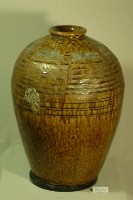 藏品(棕紅釉虎皮紋拍打印紋窄口豐肩式陶甕)的圖片