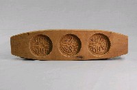 藏品(長條板單面雕三枚銀圓形糕印)的圖片