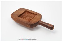 藏品(酒瓶形單面雕椰樹紋帶柄餅印)的圖片