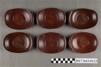 藏品(褐色橢圓形塑膠茶托組)的圖片