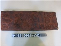 藏品(木製雙面人物動物紋拓印工具)的圖片