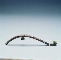 藏品(錯銀捲雲紋螭龍帶鉤)的圖片