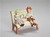 藏品(長椅上的少年男女小丑)的圖片