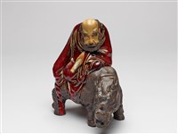 藏品(石灣窯石榴紅釉羅漢騎犀像)的圖片