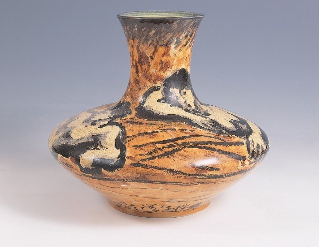 Vase with figure design in yellow glaze
