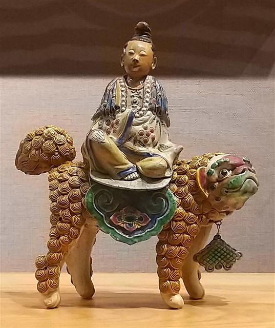 觀音騎豺的圖片