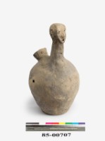 Gray earthenware vessel.in the shape of a person.  Collection Image, Figure 3, Total 4 Figures