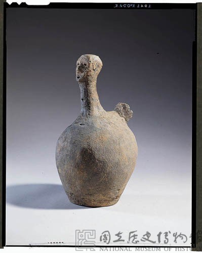 Gray earthenware vessel.in the shape of a person.  Collection Image, Figure 2, Total 4 Figures