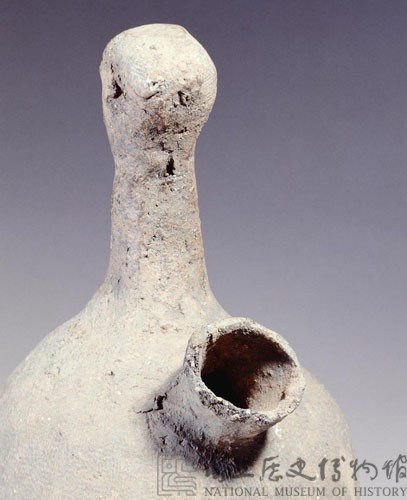 Gray earthenware vessel.in the shape of a person.  Collection Image, Figure 4, Total 4 Figures