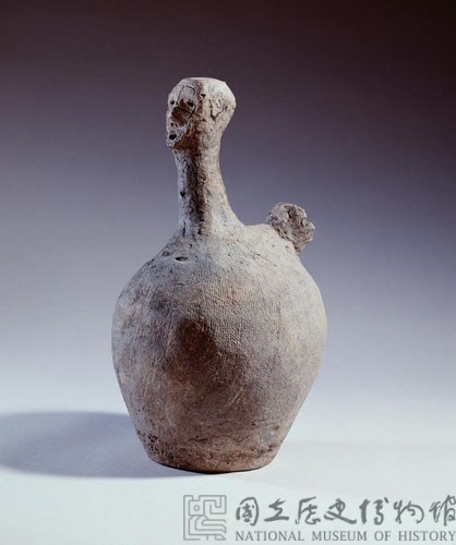Gray earthenware vessel.in the shape of a person.  Collection Image, Figure 1, Total 4 Figures