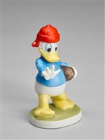 唐老鴨玩橄欖球的圖片