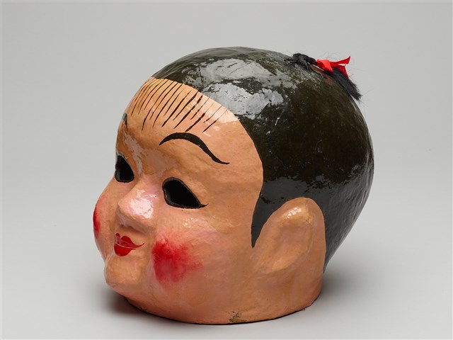 大頭娃娃(女)的圖片