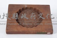 單面陰刻花葉形楠木餅印藏品圖，第1張