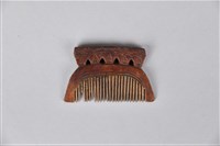 人面木製梳藏品圖，第1張