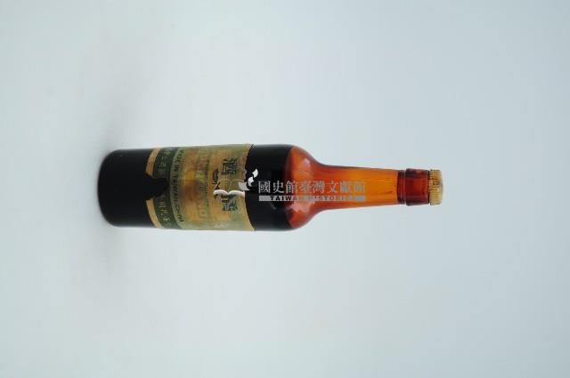 橘酒樣品棗色透明玻璃小型酒瓶藏品圖，第1張