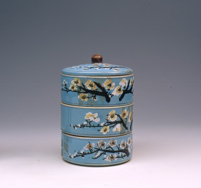 Multi-layer Container with Pulm Blossomson Blue Background