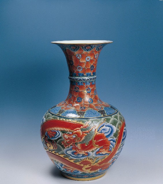 Carved and Painted Globular Vase with Apron Rim