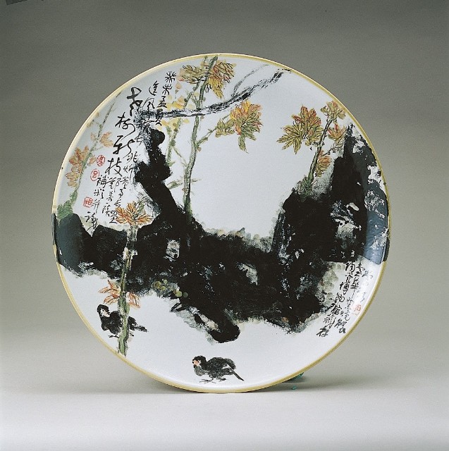Large and round plate with old tree and new branch